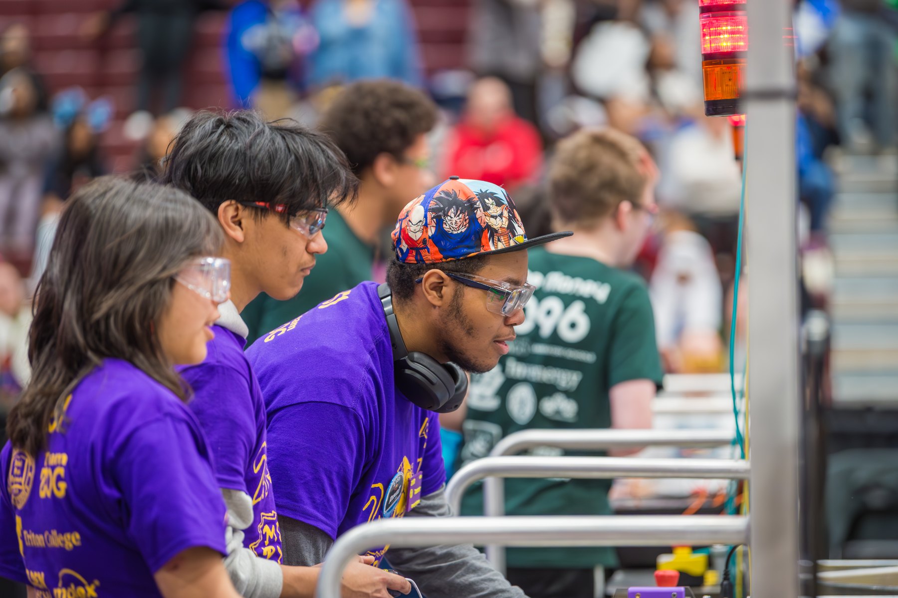 Team members competing at a robotics event